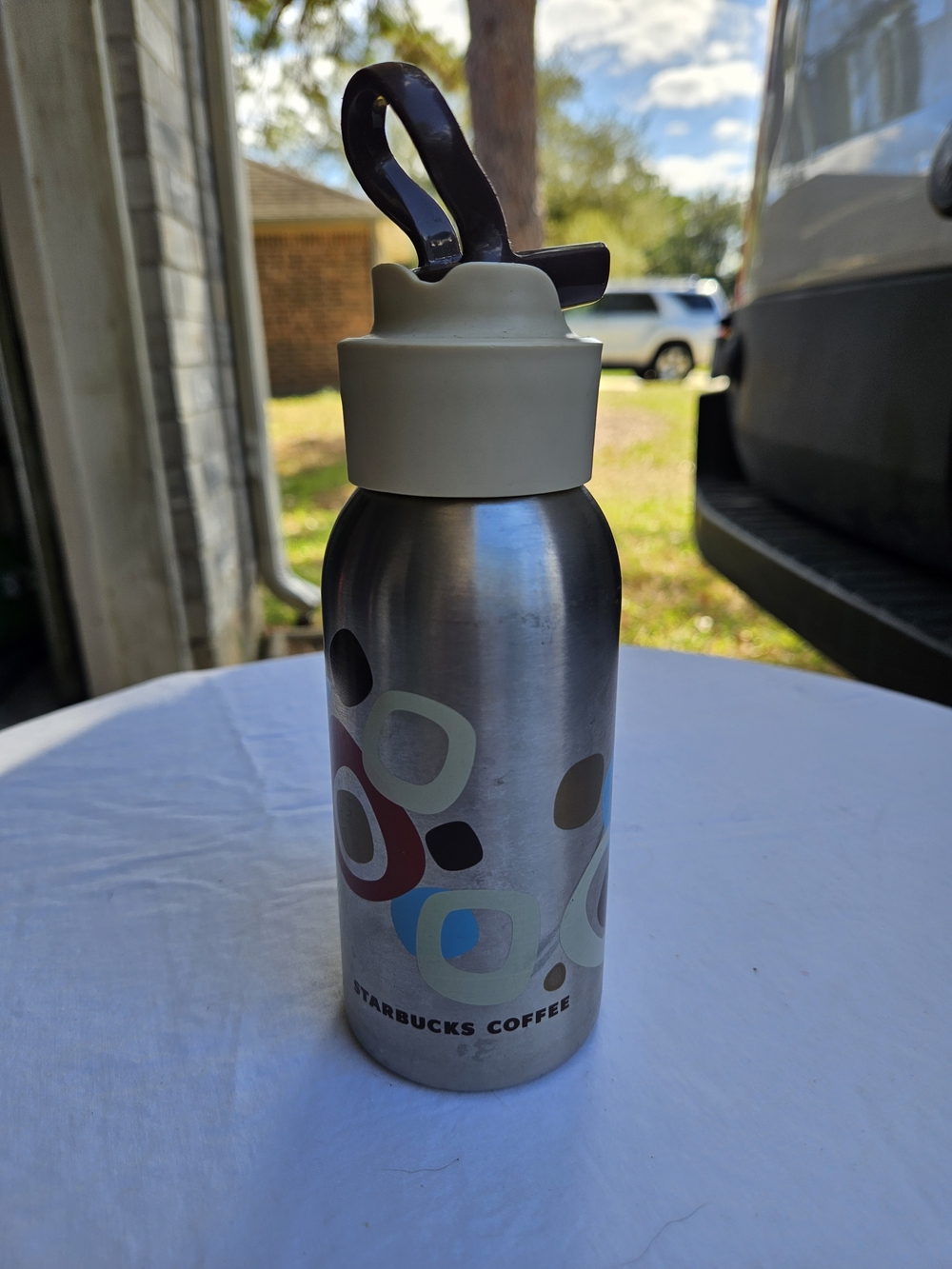 Starbucks Silver Water Bottle with Cream Lid and Brown Handle